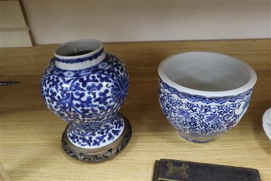 A Chinese blue and white jardiniere, Kangxi mark, and a similar vase, 20.5cm with hardwood stand